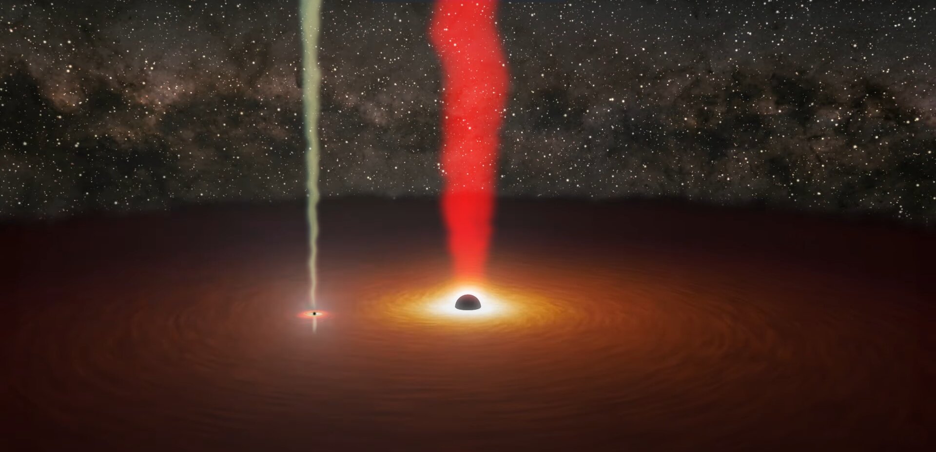 Wizja artystyczna galaktyki aktywnej OJ 287, w której centrum znajduje się nie jedna, a dwie okrążają się nawzajem czarne dziury. Obu obiektom towarzyszą dżety: większy, związany z bardziej masywną czarną dziurą, o czerwonawym zabarwieniu, i mniejszy o barwie żółtawej. Zwykle widoczny jest tylko czerwonawy dżet, ale w listopadzie 2021 przez 12 godzin słabszy dżet stał się tym dominującym. Dzięki temu po raz pierwszy bezpośrednio zaobserwowano obecność mniejszej czarnej dziury w układzie. Źródło: NASA/JPL-Caltech/R. Hurt (IPAC) & M. Mugrauer (AIU Jena).